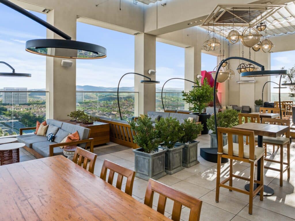 Upscale restaurant patio with ceiling-mounted electric heaters and guests dining